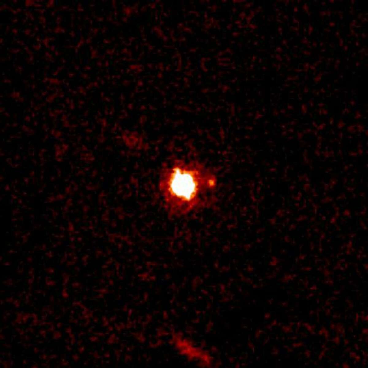 ** CORRECTS TYPE OF CELESTIAL BODY ** In this photo provided by the W.M. Keck Observatory in Kamuela, Hawaii, the Kuiper Belt object 2003 UB313 (nicknamed "Xena") received an official name Wednesday, Sept. 13, 2006, as Eris, named after the Greek goddess of chaos and strife and its satellite, Gabrielle, also received a formal name Dysnomia are shown. The dwarf planet appears in the center, while the moon is the small dot at the 3 o'clock position. The christening of Eris, named after the Greek goddess of chaos and strife, was announced by the International Astronomical Union Wednesday. Weeks earlier, the professional astronomers' group stripped Pluto of its planethood under new controversial guidelines. (AP Photo/W.M. Keck Observatory, Michael Brown) ** NO SALES ** Ran on: 09-15-2006 Michael E. Brown, left, named the Kuiper Belt object designated 2003 UB313 (which he had nicknamed Xena), above, Eris, after the Greek goddess of chaos and strife.