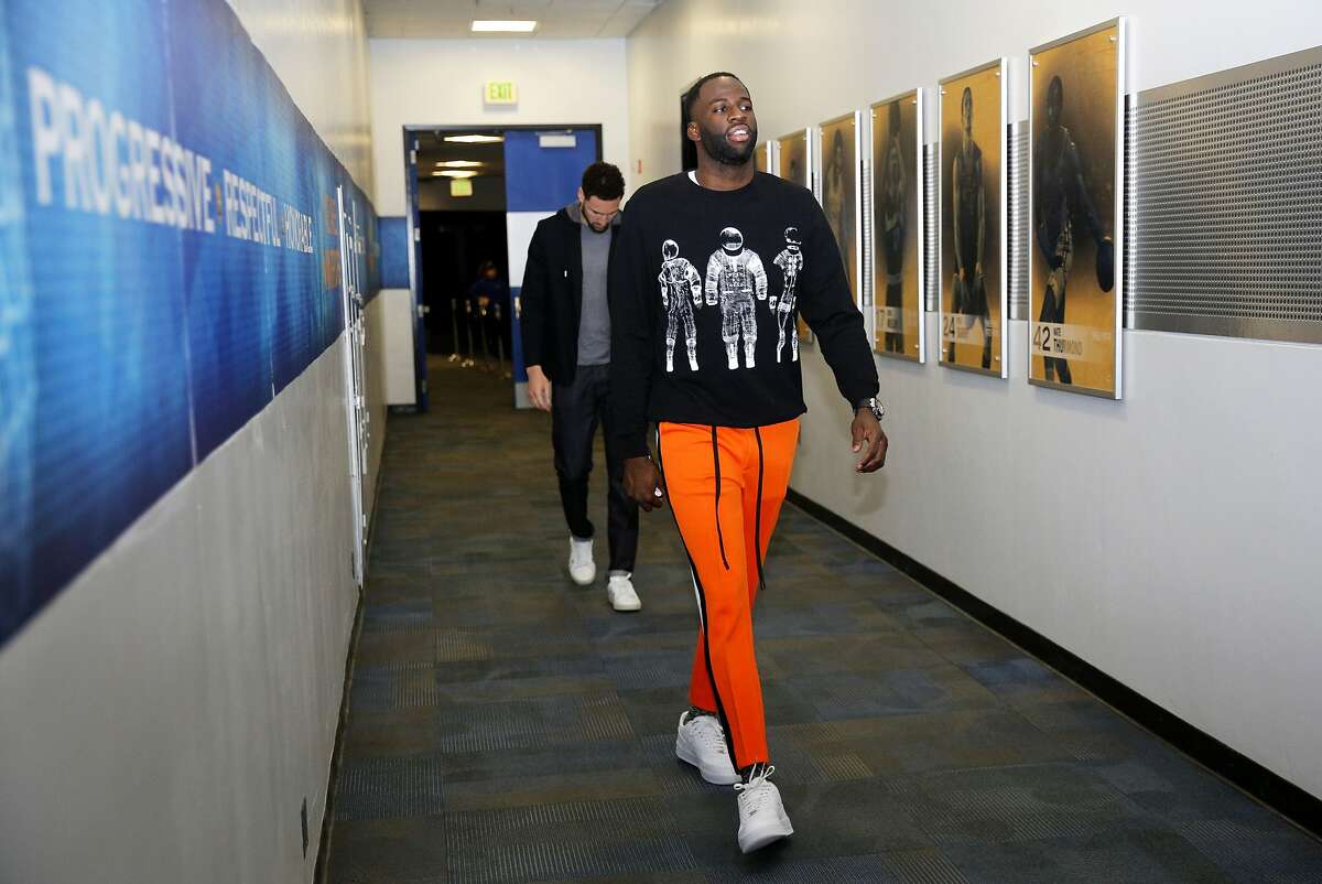 Golden State Warriors Draymond Green (right) and Klay Thompson arrive to Oracle Arena before an NBA game against the Chicago Bulls on Friday, Jan. 11, 2019, in Oakland, Calif.