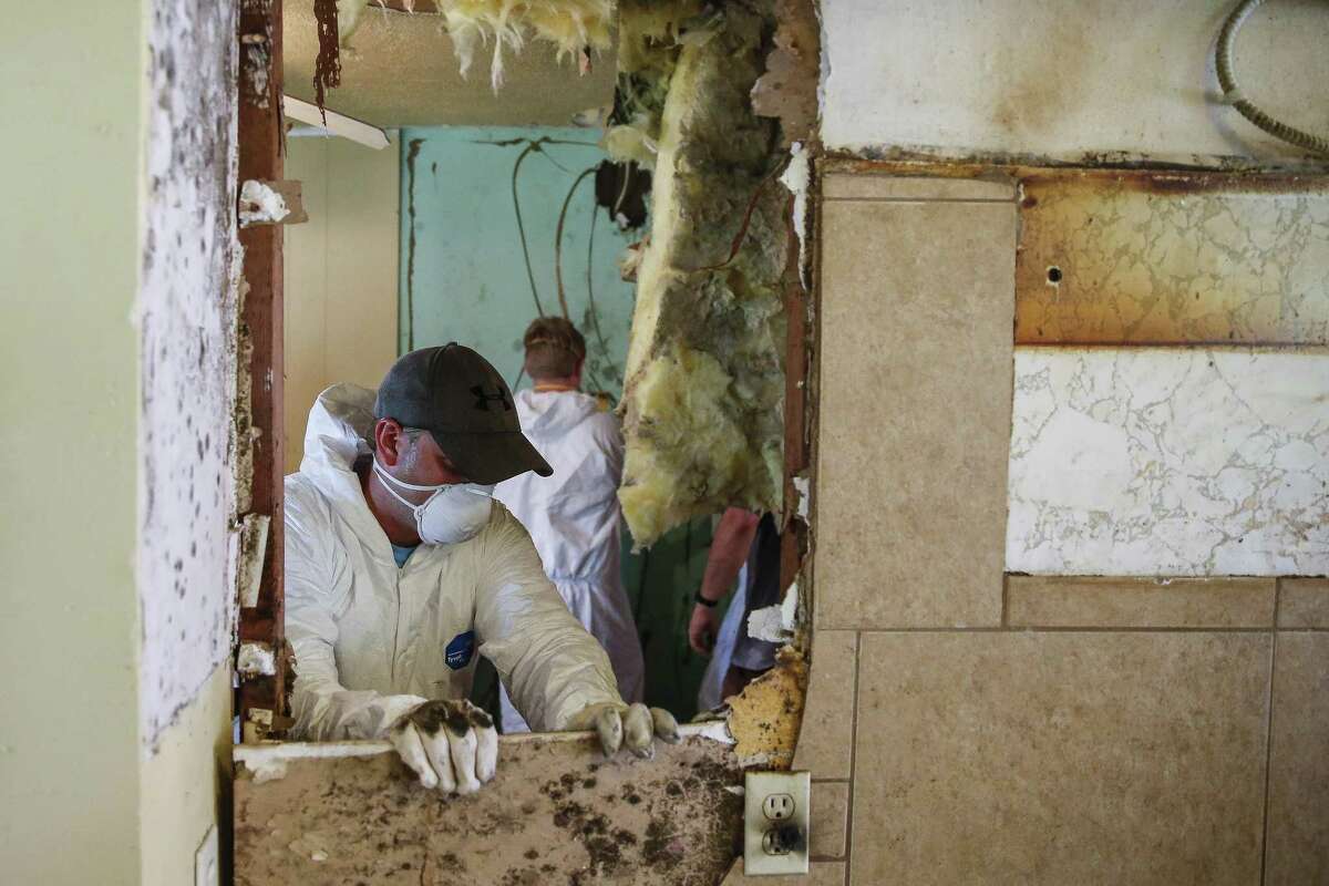Volunteers with the Louisburg, Kansas United Methodist Church work to demo and rebuild the home of Jean Gabriel July 17, 2018 in Houston. Gabriel had to move in with her daughter and out of her home, which she had been living in for 43 years, after it was damaged during Hurricane Harvey. The United Methodist Church will be using a $1,050,000 grant from the Rebuild Texas Fund to repair Hurricane Harvey damaged homes in 13 underserved counties. (Michael Ciaglo / Houston Chronicle)