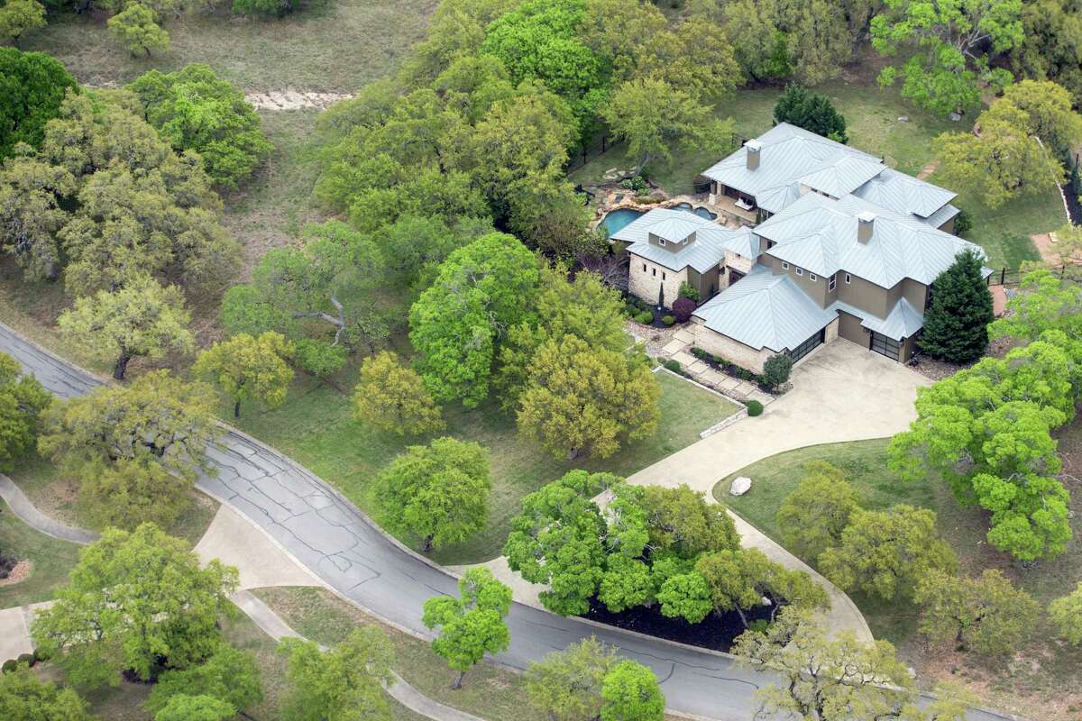 Charles Wheeler's Anaqua Springs Ranch home is seen in a Tuesday, April 3, 2019 aerial image. The home is where authorities found Wheeler's girlfriend, 37-year-old Nichol Olsen, and her two daughters, 16-year-old Alexa Montez and 10-year-old London Bribiescas, shot to death. The medical examiner ruled the children's deaths homicides and ruled Olsen had killed herself though many of Olsen's friends have rejected any possibility that she would harm herself or her children.