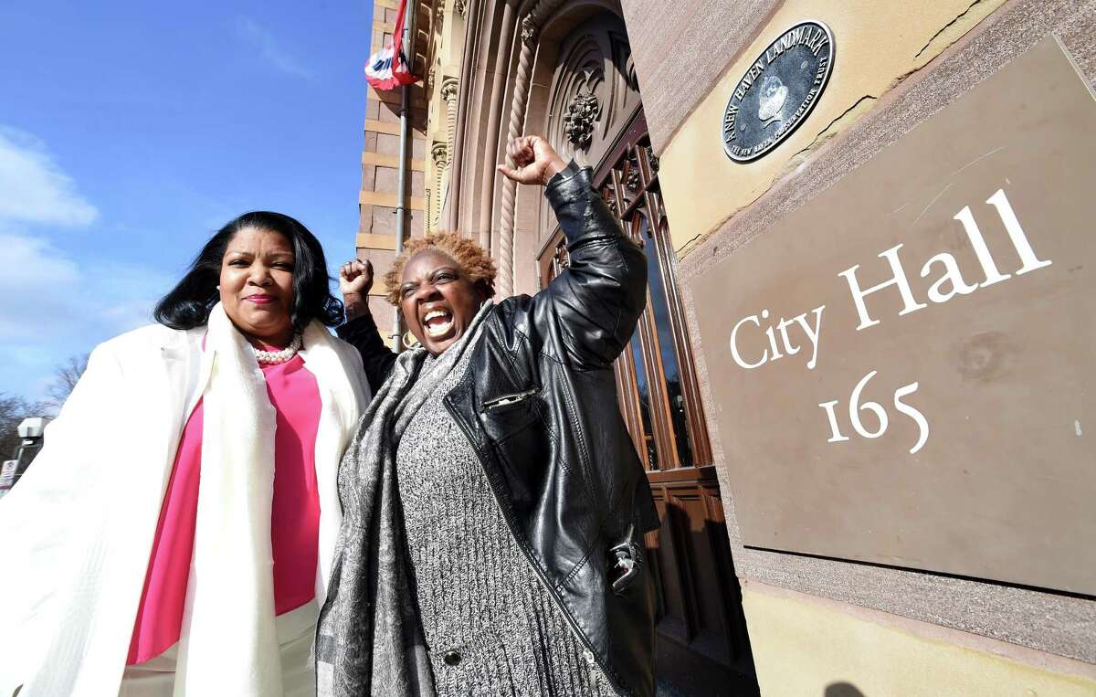 Nichole Jefferson, left, former executive director of the Commission on Equal Opportunities, is photographed in front of City Hall in New Haven with Cherlyn Poindexter, former union president of Local 3144, on April 2, 2018.