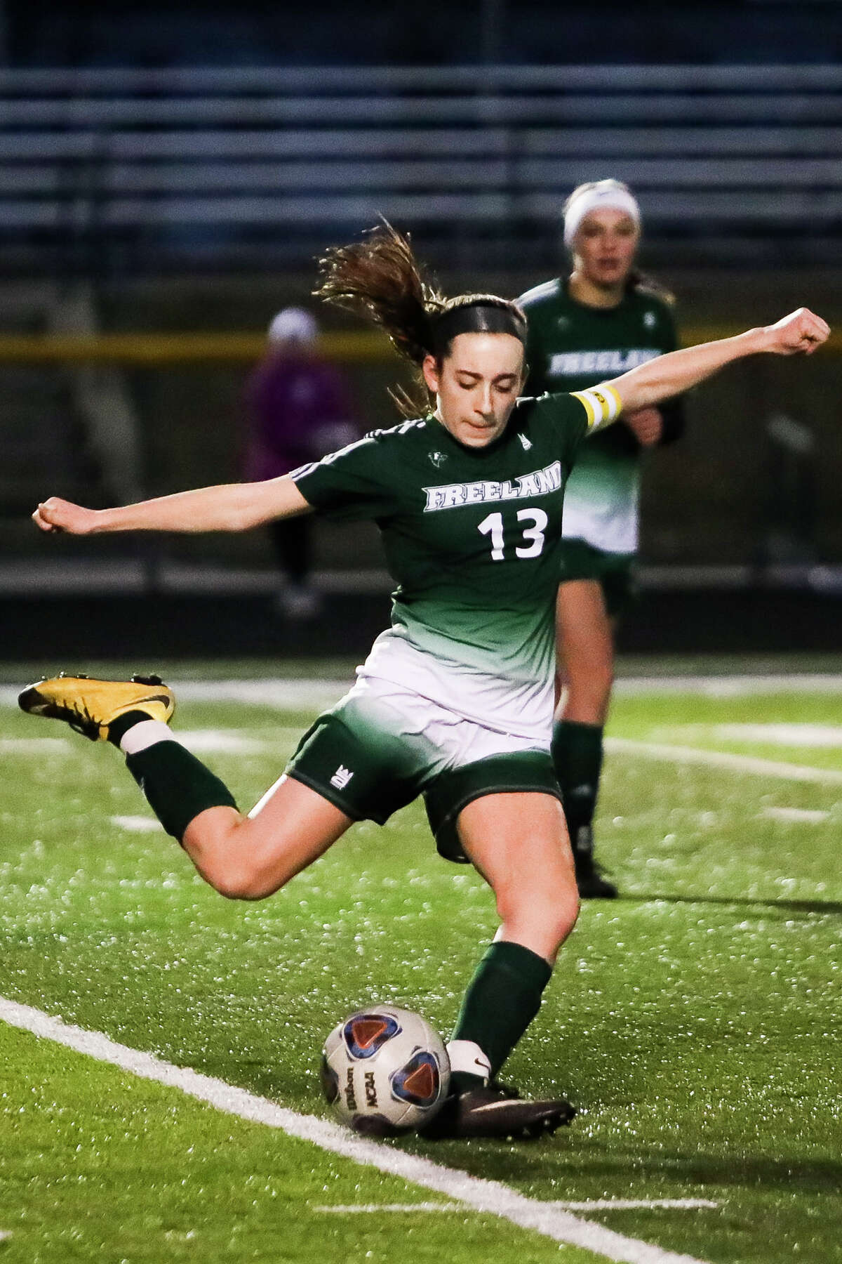 Freeland's Victoria Pilon sends the ball down the field during a game against Midland on Wednesday, April 3, 2019 at Freeland High School. (Katy Kildee/kkildee@mdn.net)