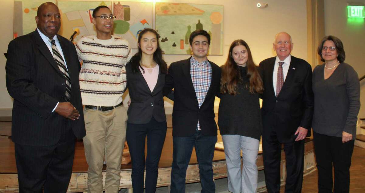 The winners of the 2019 TEAM Westport Teen Diversity Essay Contest post with TEAM Westport Chair Harold Bailey (far-left), Westport First Selectman Jim Marpe (second from right) and Jocelyn Barandiaran, Sr. Vice President of the Westport Library Board (far-right) at the contest's awards ceremony at th Saugatuck Congregational Church on April 3. From left to right the winners were Chet Ellis, first place, Angela Ji, second place, Daniel Boccardo, third place, and Olivia Sarno, honerable mention.