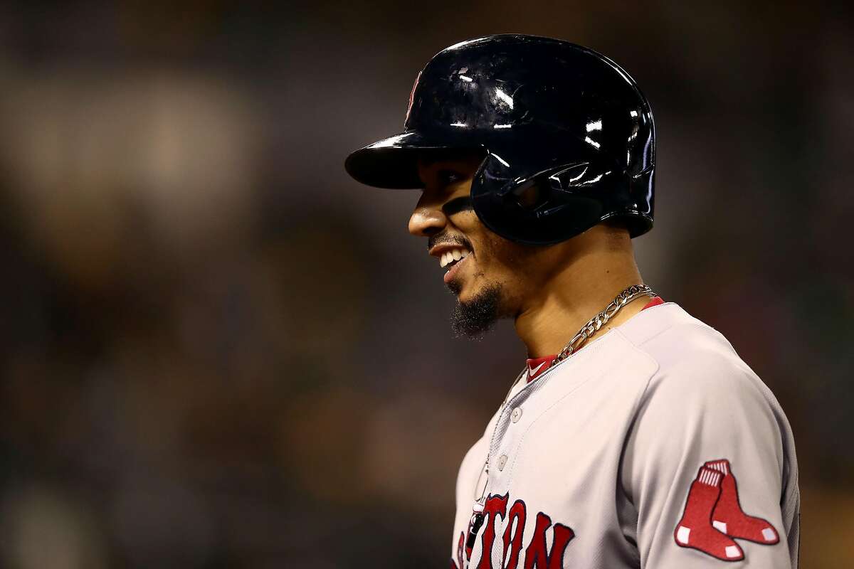 OAKLAND, CALIFORNIA - APRIL 03: Mookie Betts #50 of the Boston Red Sox smiles after he hit a double that scored two runs in the ninth inning against the Oakland Athletics at Oakland-Alameda County Coliseum on April 03, 2019 in Oakland, California. (Photo by Ezra Shaw/Getty Images)