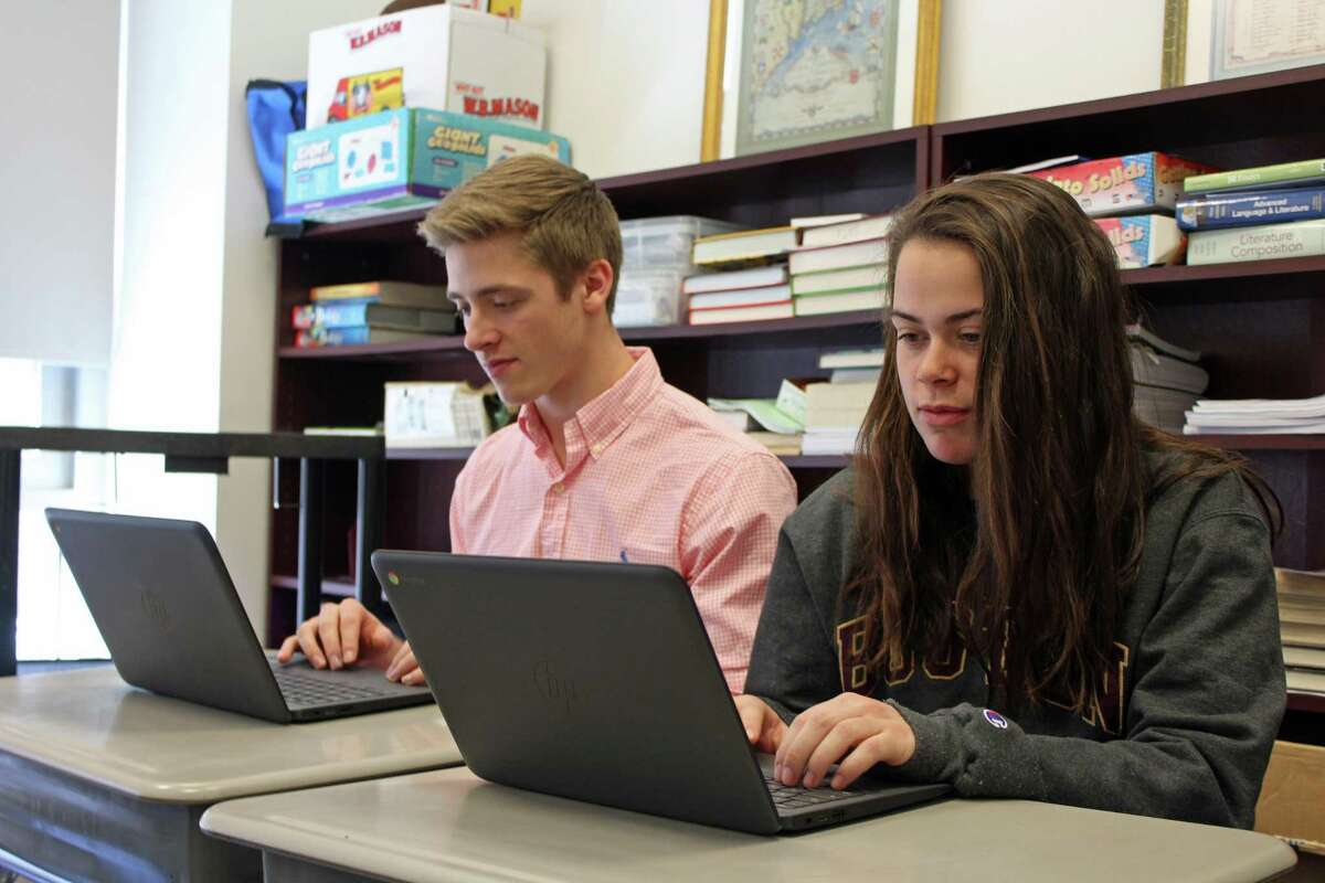 From left: Max Pfleghar and Bridget Paulmann, Spanish 6 students at Fairfield Ludlowe High School, will be taking the STAMP test April 4.