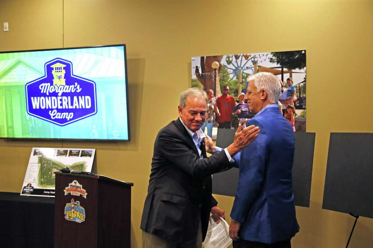 Gordon Hartman (right), the founder of Morgan’s Wonderland, and Joe Gorder, president and CEO of Valero Energy Corp., unveil plans April 4, 2019, for a camp that will be designed for people with disabilities though it will be open to everyone.