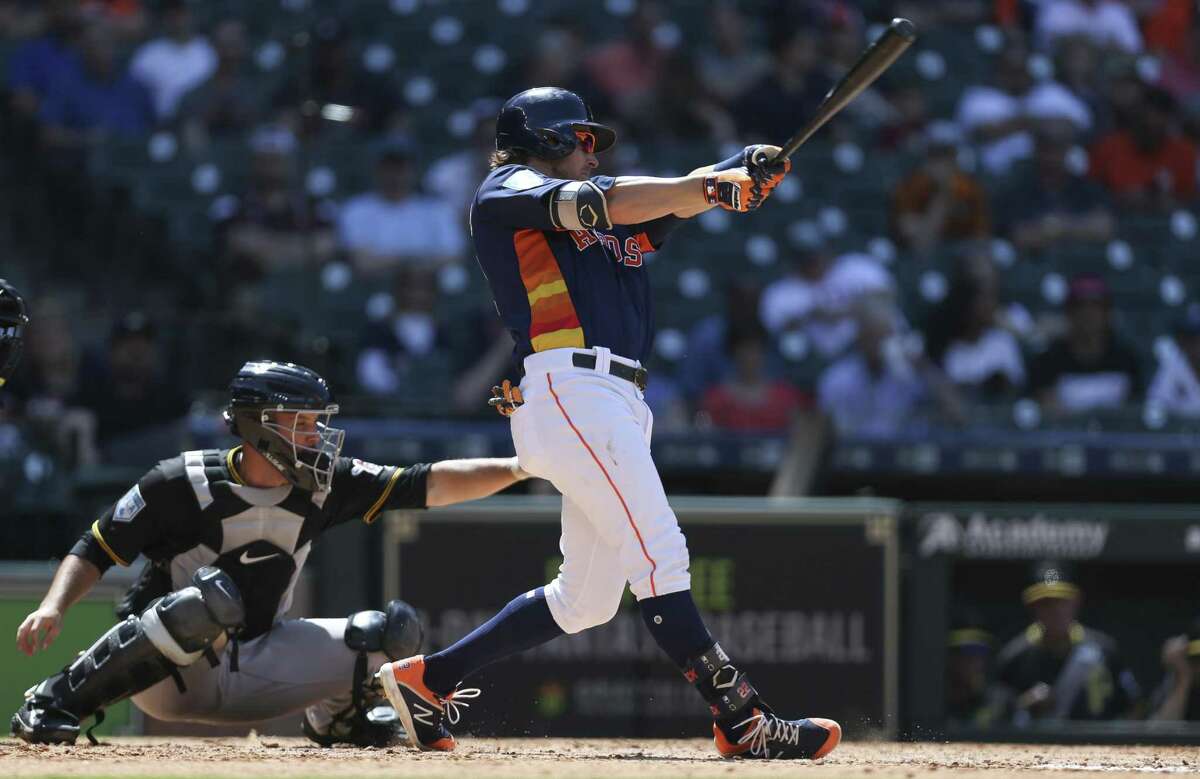 Houston Astros right fielder Josh Reddick (22) swings during the bottom fifth inning of the MLB exhibition game against the Pittsburgh Pirates at Minute Maid Park on Tuesday, March 26, 2019, in Houston.