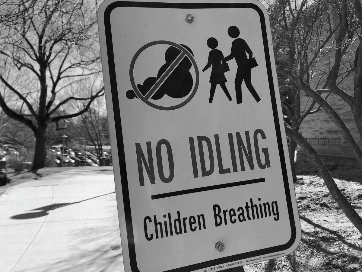 A road sign cautions against idling cars near Fairfield Ludlowe High School in Fairfield.