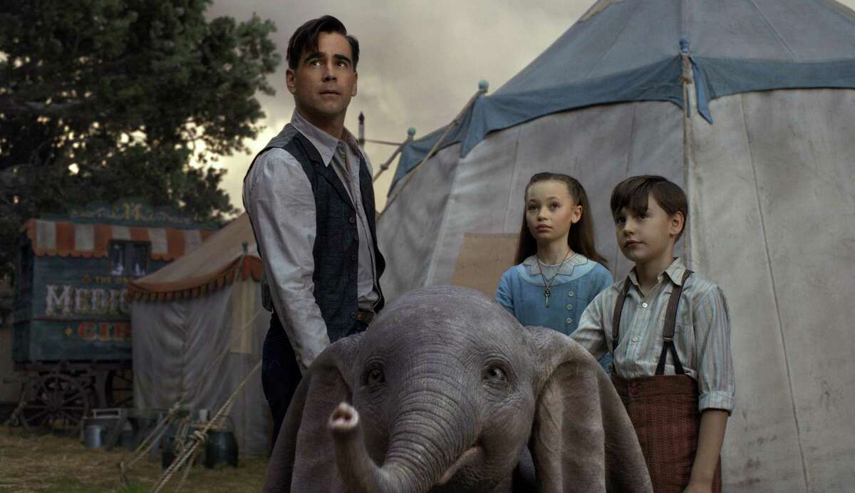 This image released by Disney shows Colin Farrell, Nico Parker and Finley Hobbins in a scene from