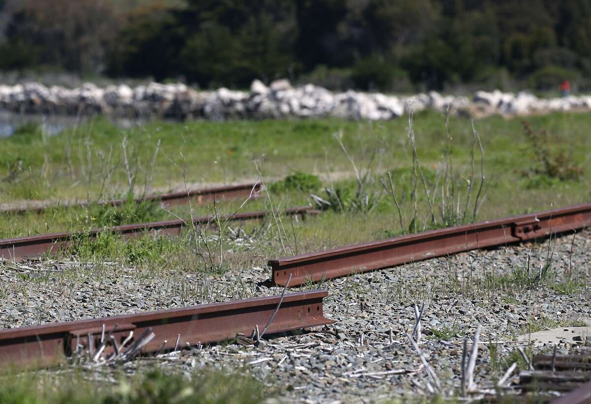 Disconnected sections of railroad track leading from an old railway terminal remain at Ferry Point of the Miller/Knox Regional Shoreline in Richmond, Calif. on Saturday, March 30, 2019. The East Bay Regional Park District wants to remove some abandoned sections of railroad tracks but the BNSF Railway Company wants to reactivate a portion of the spur.