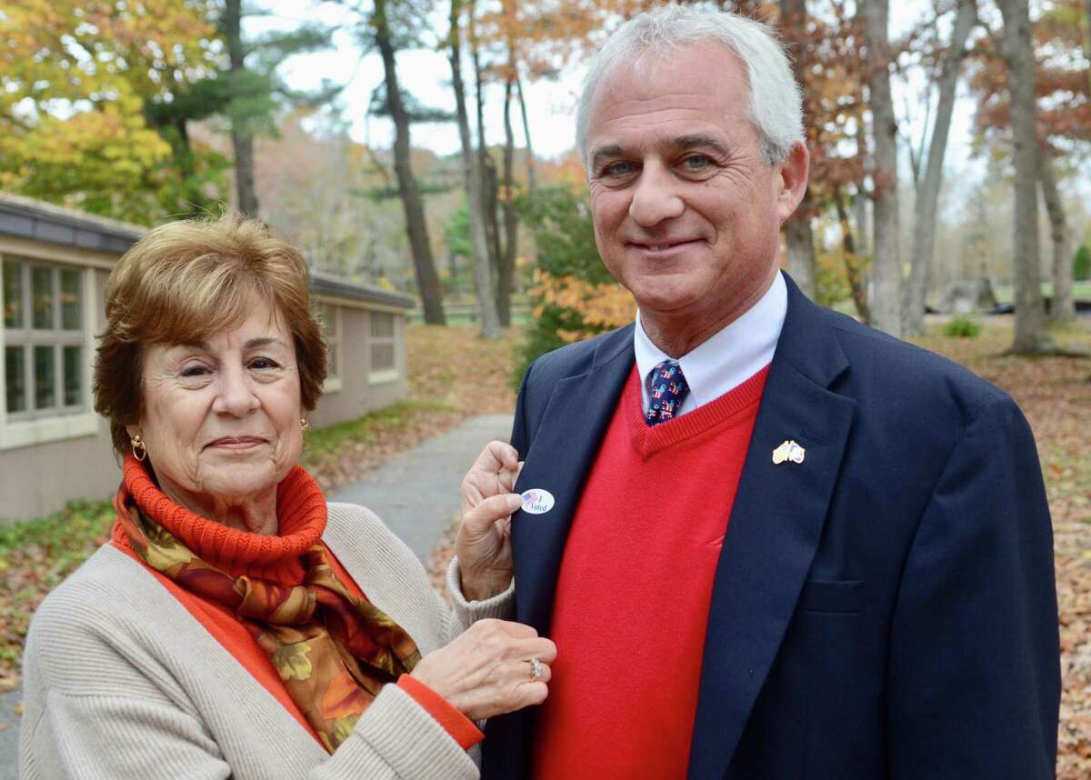 Madison First Selectman Tom Banisch with voter registration poll worker Donna Dougherty in a previous election.