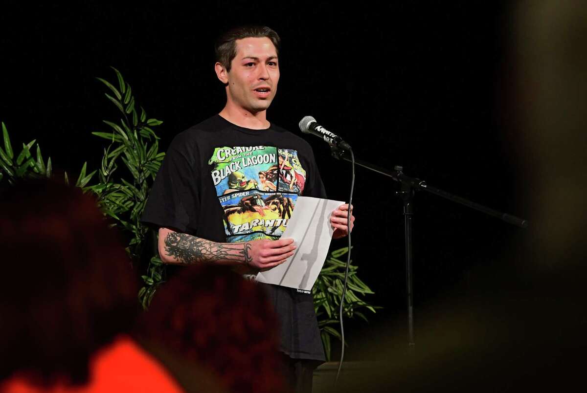 Gregory Wilder of Schenectady reads a poem about being addicted to poetry during CapCity Slam at the Albany Barn on Wednesday, April 3, 2019 in Albany, N.Y. (Lori Van Buren/Times Union)