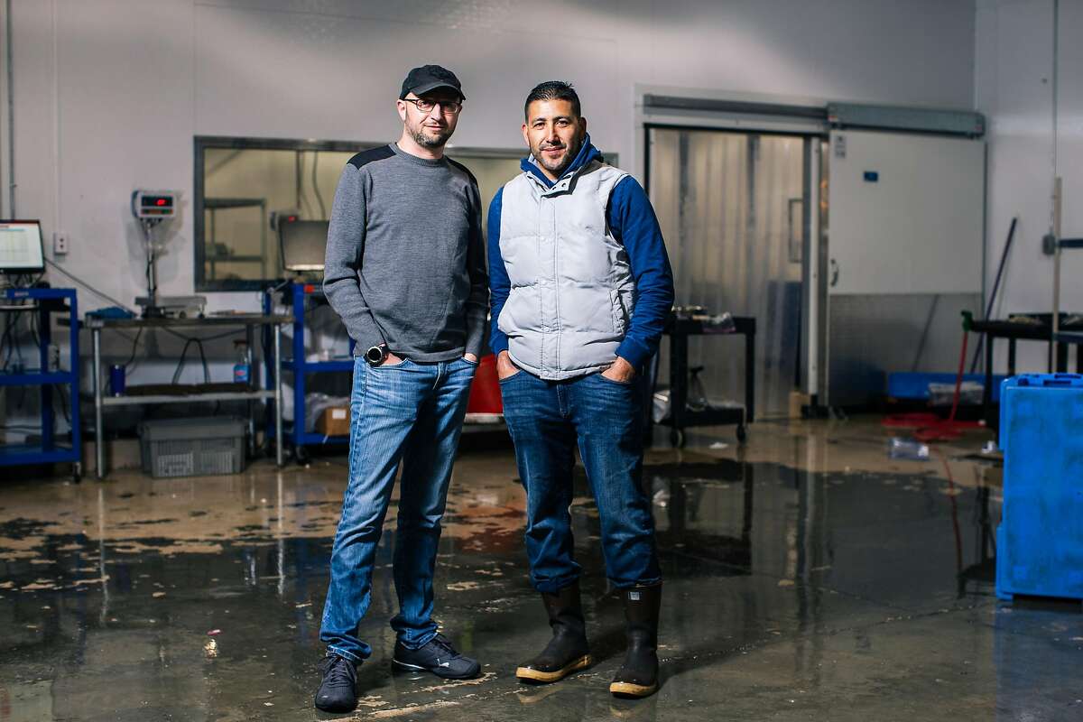 In 2019, Adrian Hoffman, left, and Ismael Macias, inside their San Francisco seafood company, Four Star Seafood. They just opened Billingsgate, an oyster bar and seafood counter in Noe Valley.