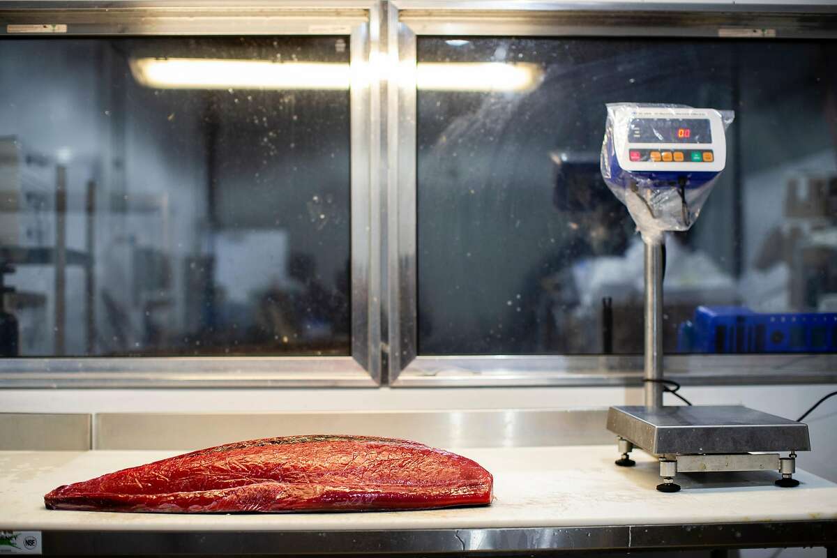 A tuna fillet rests on a table prior to be portioned for various restaurants at Four Star Seafood in San Francisco, Calif. on Wednesday, April 3, 2019.
