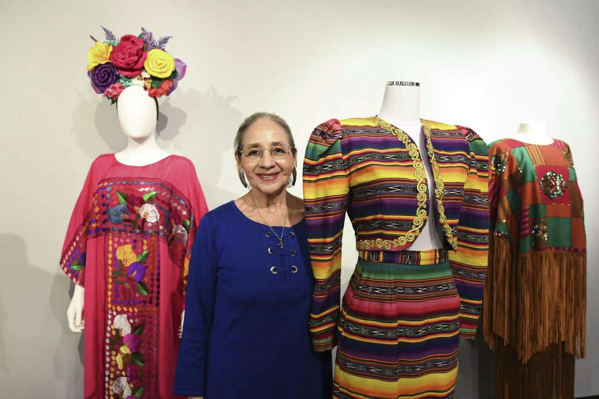 Designer Graciela Carrillo displays some of her handmade works on display at the “Fiesta Fashion, Fiesta Passion,” a Fiesta-themed exhibit at the UTSA Institute of Texan Cultures. .