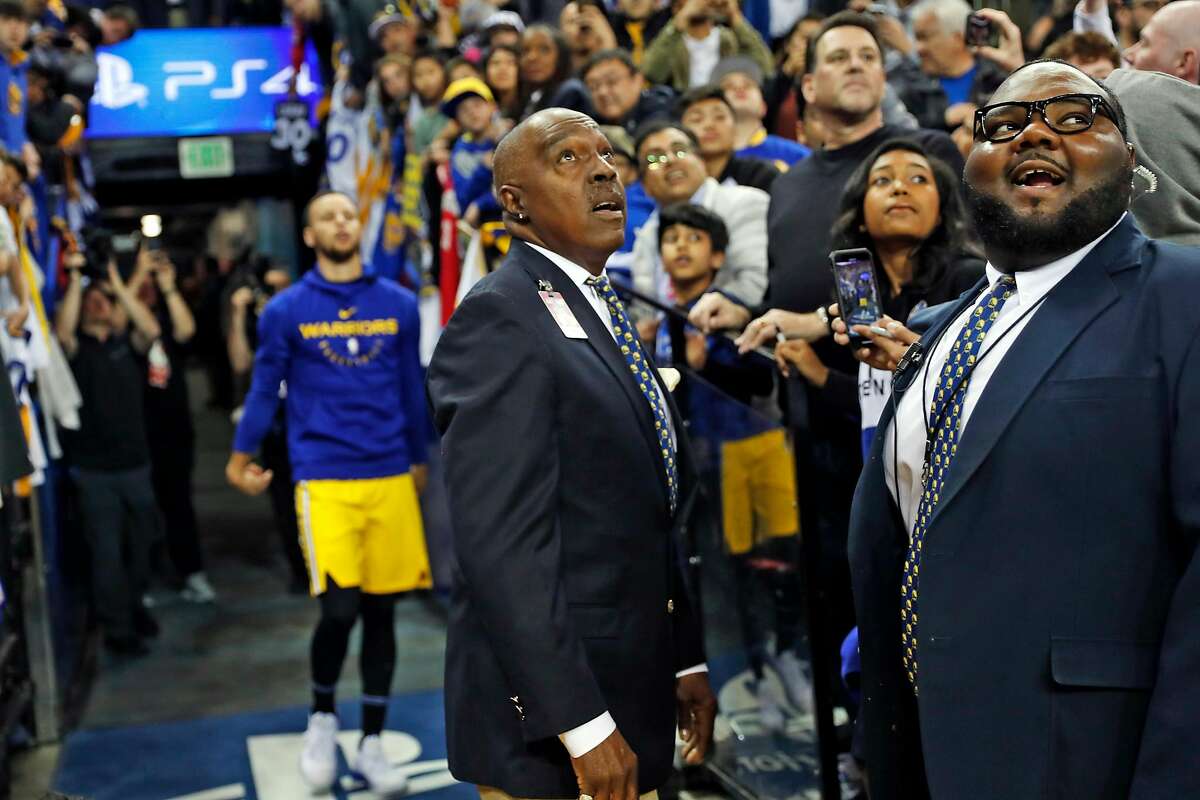 After passing the ball, Oracle Arena security guard Curtis Jones watches its flight as Golden State Warriors' Stephen Curry does his tunnel shot ritual in Oakland, Calif., on Monday, April 2, 2019. On this night, Curry missed all five of his attempts.