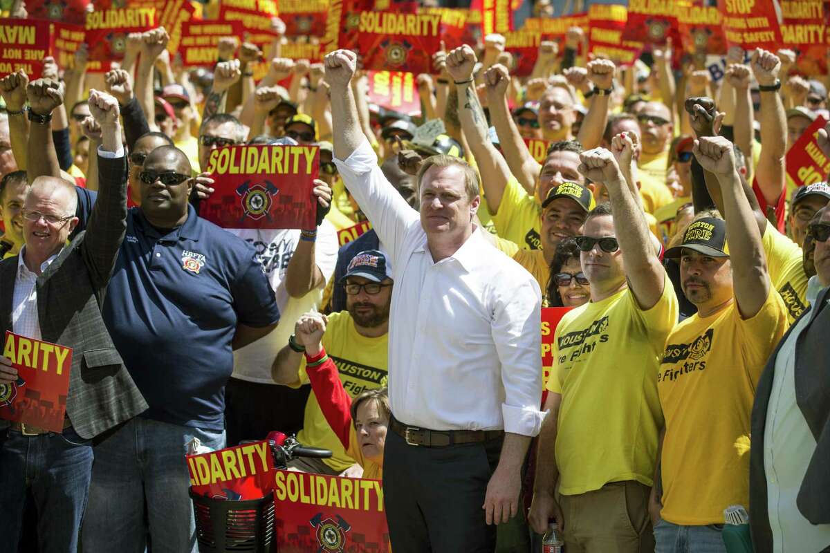 Marty Lancton, the head of the Houston Professional Fire Fighters Association, stands with his membership during a march on City Hall over the labor dispute related to Proposition B on Tuesday, March 19, 2019, in Houston.