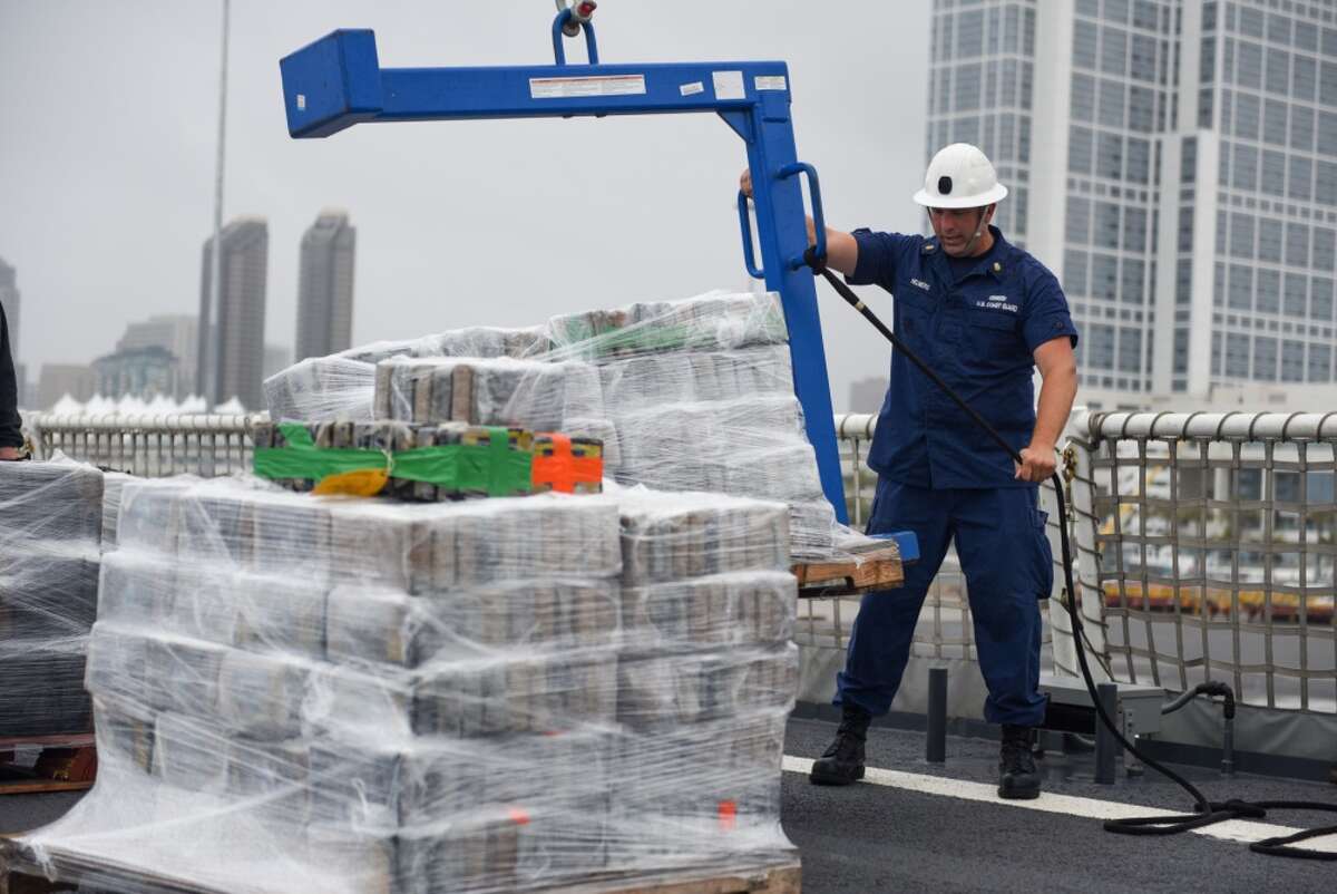 Petty Officer 1st Class Gregory Helmers, a boatswain's mate aboard Coast Guard Cutter Waesche, offloads contraband from the cutter at Tenth Avenue Marine Terminal in San Diego April 5, 2019. More than 7.1 tons of cocaine were seized during six separate interdictions off the coasts of Mexico, Central and South America by the Coast Guard cutters Active (WMEC-618), Steadfast (WMEC-623) and Waesche (WMSL-751).