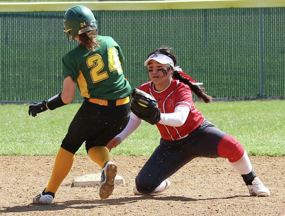 Alton shorstop Tami Wong (right) applies the tag on Southwestern’s Josie Bouillon, who his caught stealing in the fourth inning Saturday morning at Alton High in Godfrey. Photo: Greg Shashack / The Telegraph