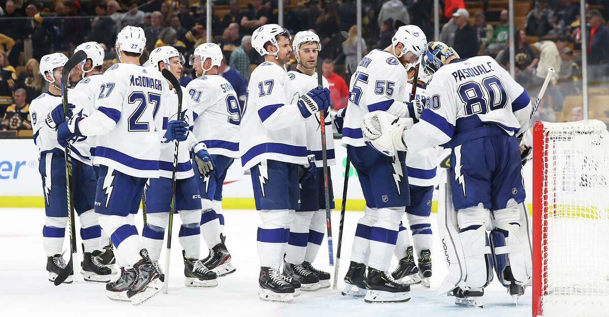 The Tampa Bay Lightning celebrate with goaltender Edward Pasquale (80) after a 6-3 win against the Boston Bruins at TD Garden in Boston on Saturday, April 6, 2019. **FOR USE WITH THIS STORY ONLY** (Maddie Meyer/Getty Images/TNS)