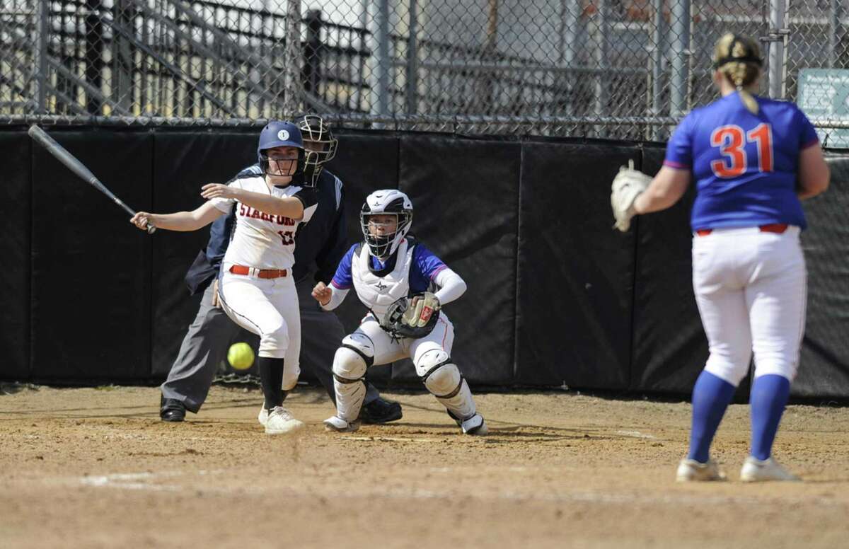 Stamford’s Diana Magarian drives in the winning run with a single in the 10th inning of -Saturday’s 7-6 victory over Danbury.