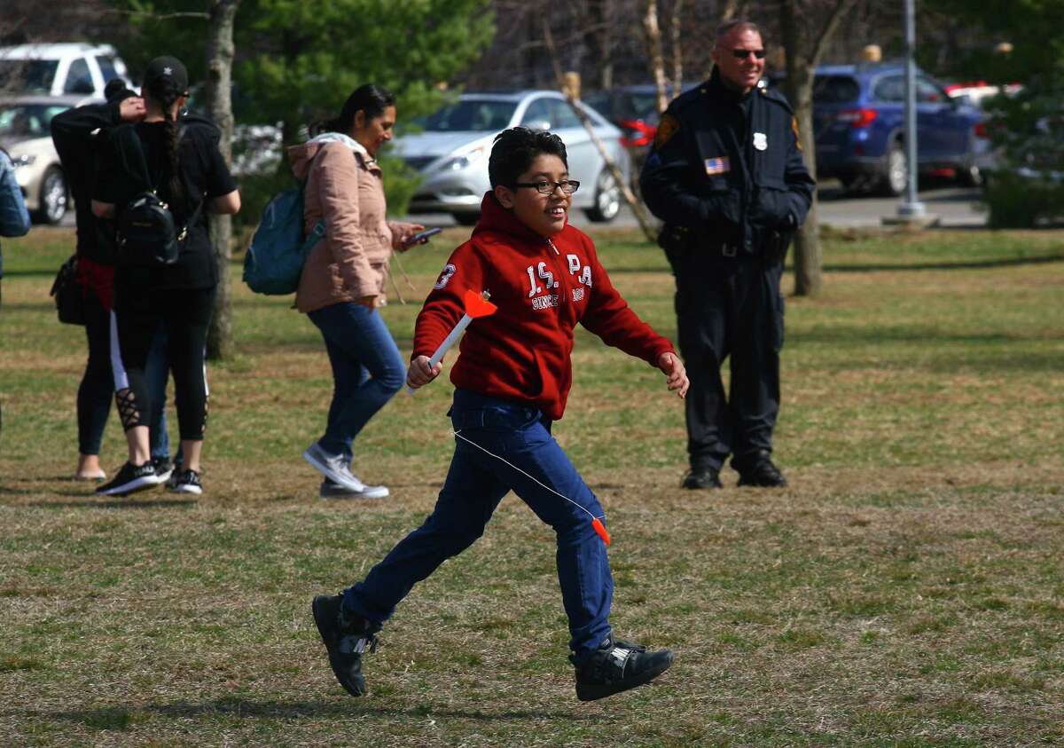 Giancarlo Perez Antonio, 11, runs back to the launch site with the rocket he shot into the air during the Discovery Museum's annual Science Day in Bridgeport, Conn., on Saturday, April 6, 2019. As many as 1400 children got to take part in a variety of activities related to space research and exploration. Some of the highlights included a Live Science Demo, Astronaut Training, drone flights with Connecticut Wild Flyers and even a piece of moon rock on display. Science Day is made possible by a grant from the NASA Connecticut Space Grant Consortium.