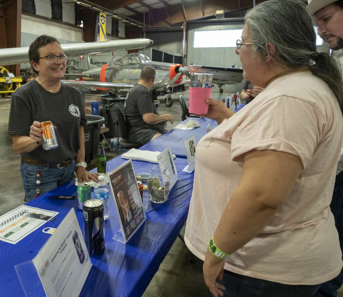 Beer lovers enjoy a night of tasting 04/06/19 at the High Sky Wing of the CAF Hops & Props fundraiser in the High Sky Wing hanger. Tim Fischer/Reporter-Telegram