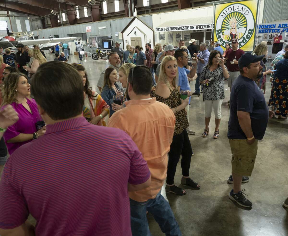 Beer lovers enjoy a night of tasting 04/06/19 at the High Sky Wing of the CAF Hops & Props fundraiser in the High Sky Wing hanger. Tim Fischer/Reporter-Telegram
