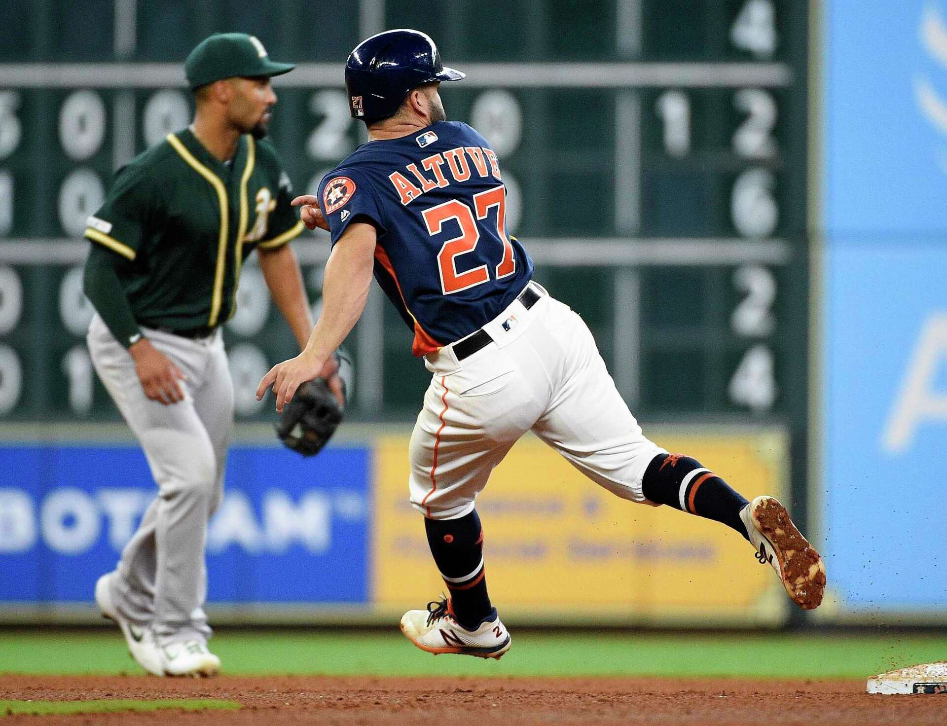 Jose Altuve, Astros walk tall as run in 9th beats A's