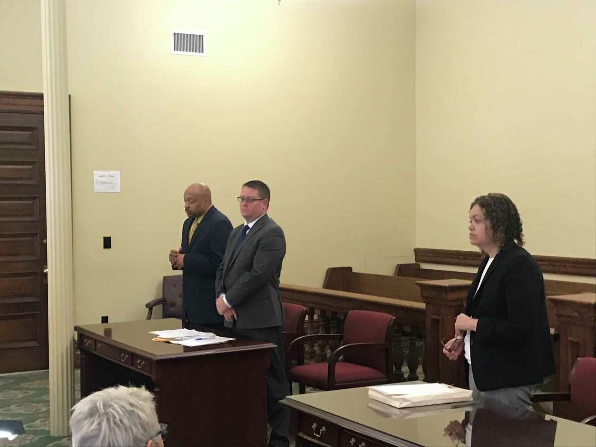 From left, retried Troy Detective Aaron Collington, , his defense attorney Joseph Ahearn, and Special Prosecutor Linda Griggs in Rensselaer County Court Monday April 8, 2019 for Collington's guilty plea to stealing $6,200 from the Troy Police Benevolent Association while he was president.