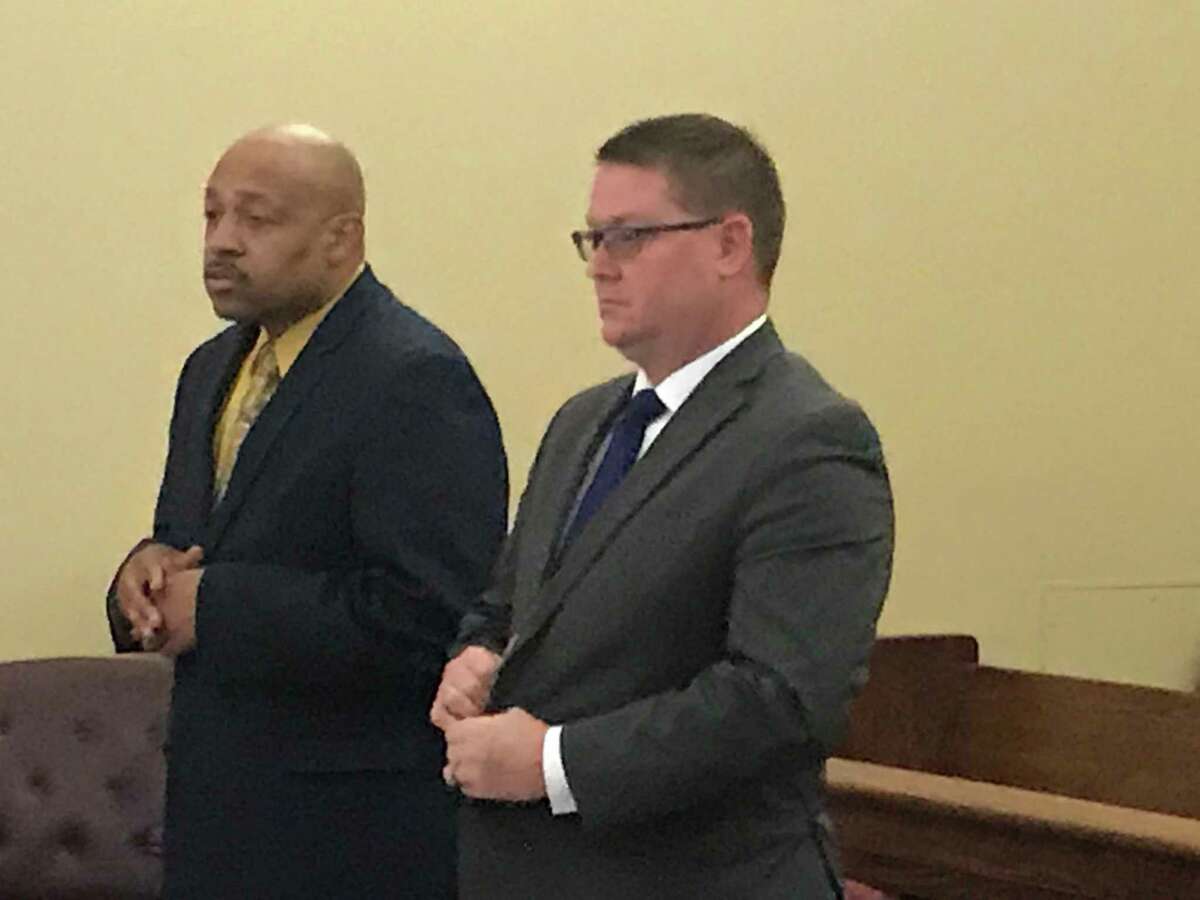 Retired Troy Detective Aaron Collington, left, appears with his attorney Josepha Ahearn Monday April 8, 2019 to plead guilty in Rensselaer County Court.