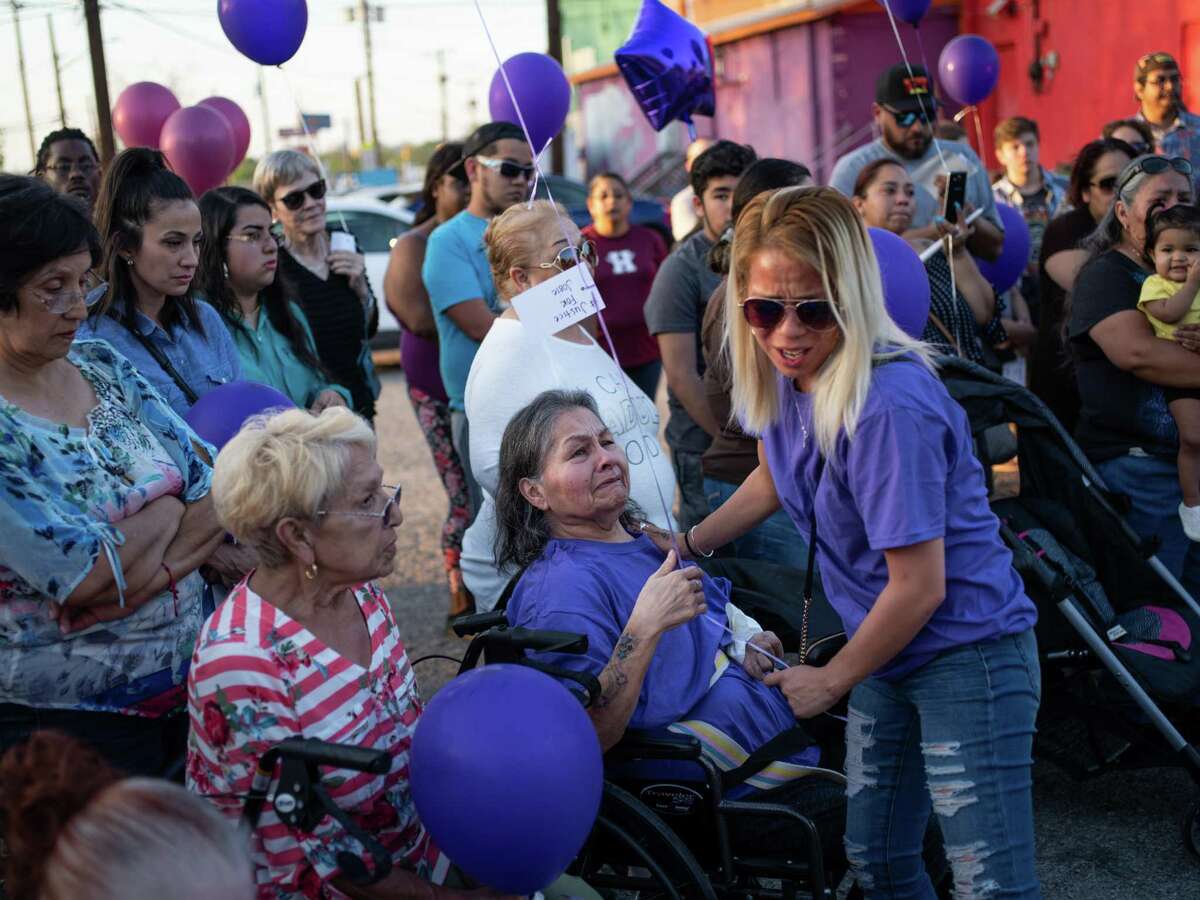 Hilda Greene, center, mother of Josephine Serrano Ramos, 36, receives a hug during a vigil for her daughter on April 4, 2019. Ramos was killed on April 1, and her husband is charged.