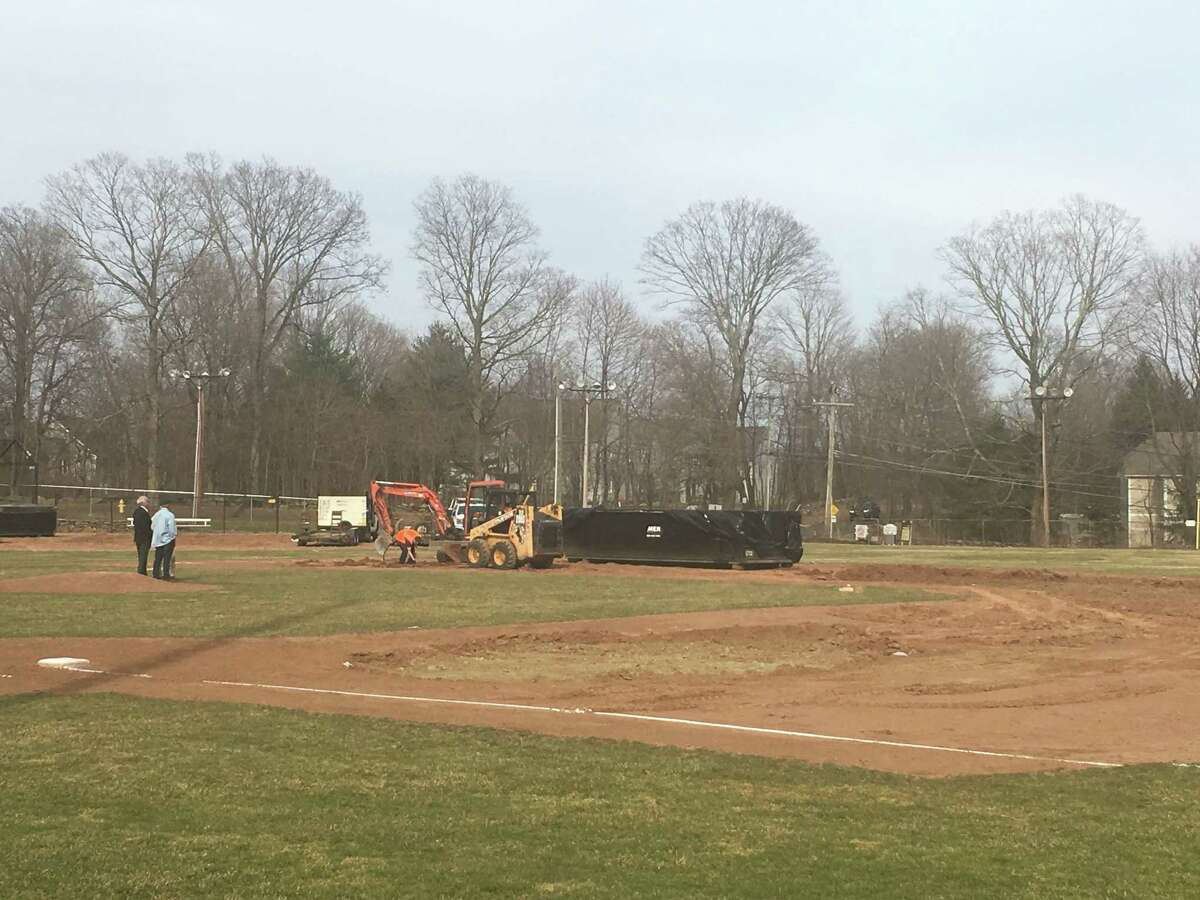 Ridgefield town officials examine the damage done to Ciuccoli Field Sunday afternoon. On Saturday, 25 gallons of gasoline were poured onto the infield and lit on fire to make the field playable for the Ridgefield High School baseball team. A certified emergency response company that specializes in hazardous waste removal dug up six to eight inches of soil from the infield Saturday into Sunday. The town hopes to have new soil placed on the field Tuesday with the team returning to action late next week or next weekend. The police are investigating the incident.