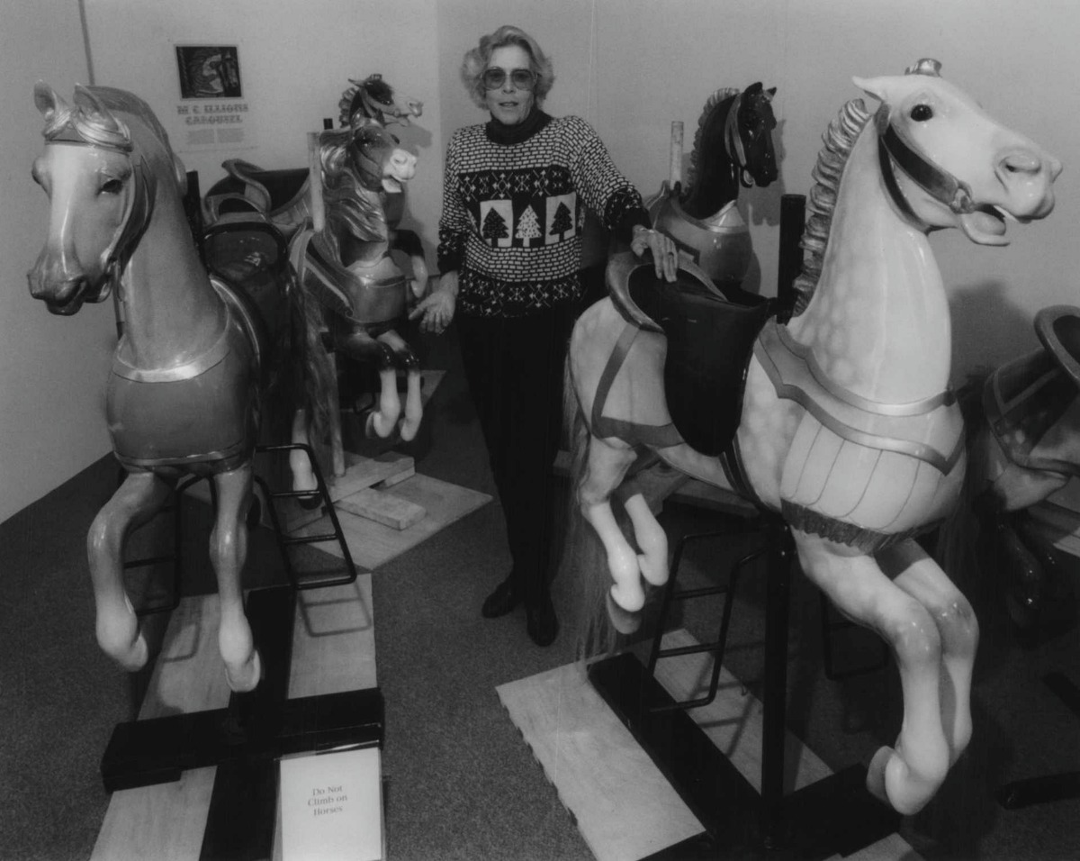 Canfield Casino, Congress Park, Saratoga Springs - Joan Sackman, gift shop manager, explains the history of the restored carousel horses on display. The wooden horses were from the Illion Carousel, built in 1905, and was located in Kadeross Park in Saratoga for many years. December 19, 1994 (James Goolsby/Times Union Archive)