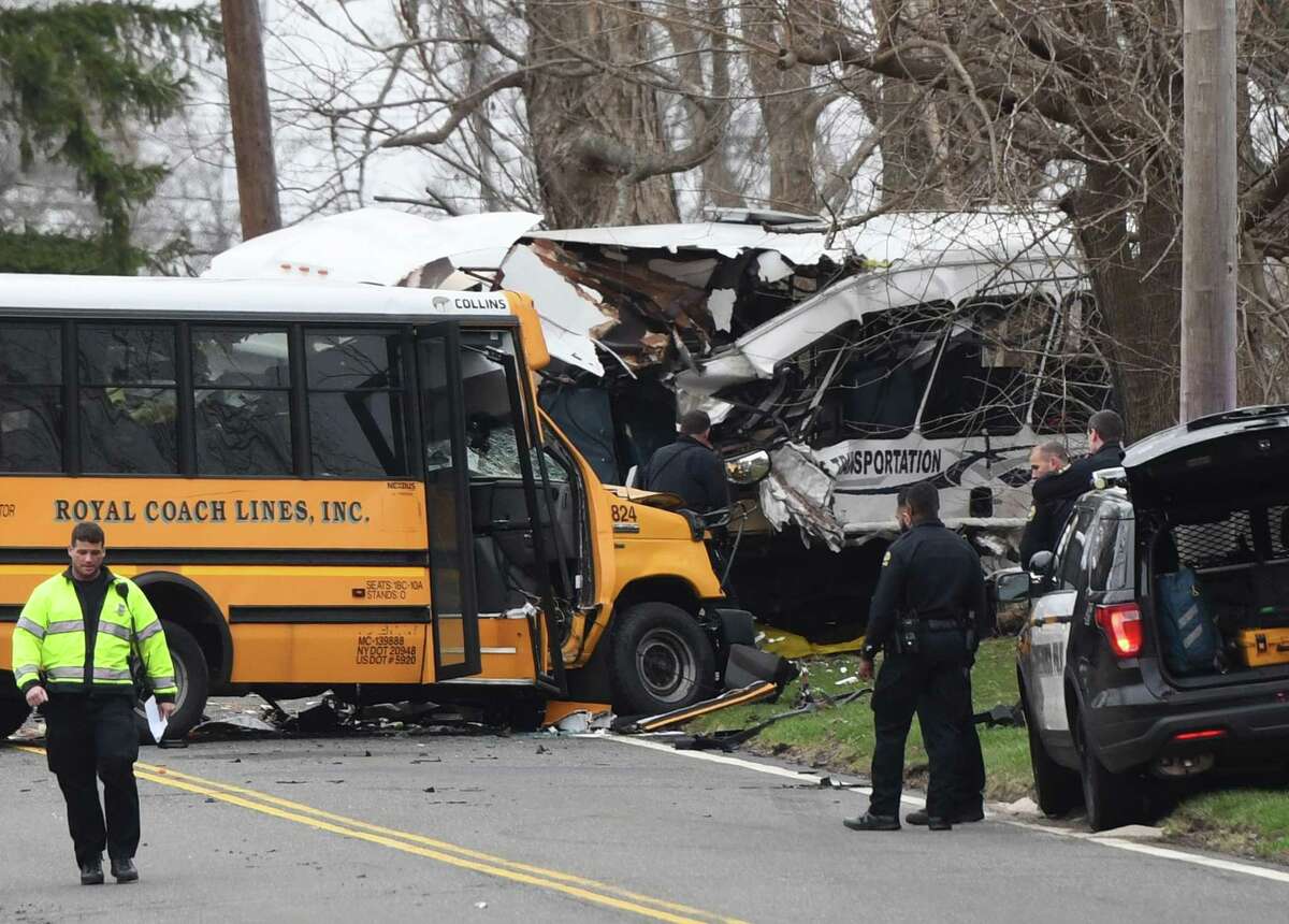 Police, EMS and firefighters respond to a school bus crash on King Street near Brunswick School in Greenwich, Conn. Tuesday, April 9, 2019.