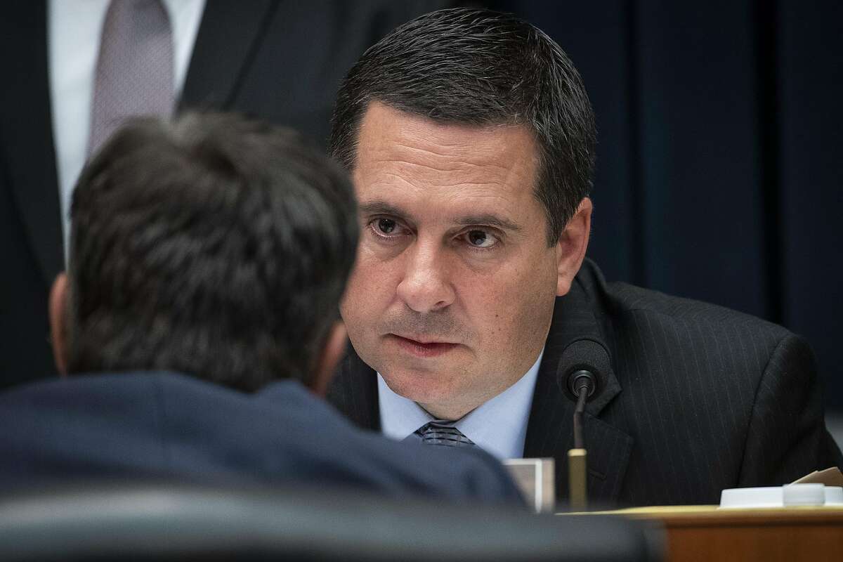 WASHINGTON, DC - MARCH 28: House Select Committee on Intelligence ranking member Devin Nunes (R-CA) confers with Rep. John Ratcliffe (R-TX) (back to camera) during a hearing concerning 2016 Russian interference tactics in the U.S. elections, in the Rayburn House Office Building, March 28, 2019 in Washington, DC. Every Republican on the committee signed a letter on Thursday demanding that committee Chairman Adam Schiff (D-CA) step down as chairman. (Photo by Drew Angerer/Getty Images)