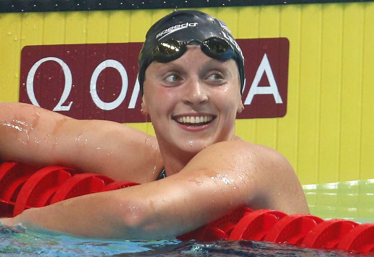 FILE - In this Tuesday, July 25, 2017 file photo, United States' Katie Ledecky reacts after winning the gold medal in the women's 1500-meter freestyle final during the swimming competitions of the World Aquatics Championships in Budapest, Hungary. A new professional league for elite swimmers will debut this year with U.S. and foreign-based teams competing in a mixed gender format. Five-time Olympic champion Katie Ledecky will compete for one of the International Swimming League's eight teams. The league said Tuesday, April 9, 2019 that the season will begin Oct. 4-5, with meets held nearly every weekend through Nov. 24. (AP Photo/Darko Bandic, File)