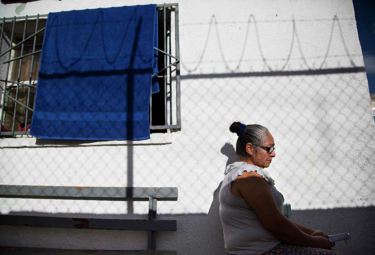 Juana Acosta, 53, a migrant from Honduras, takes shelter in April 2019 in Ciudad Juárez after U.S. immigration authorities placed her grandchildren in federal custody but sent her to Mexico to await her U.S. court date. She was among the first asylum seekers returned to Ciudad Juárez under that Trump administration policy. On Friday, a California federal court blocked the program, though an appeal to the Supreme Court is likely.