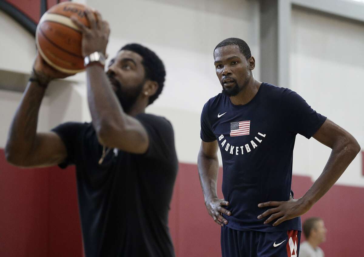 Kevin Durant, right, watches Kyrie Irving during a training camp for USA Basketball, Thursday, July 26, 2018, in Las Vegas. The two are slated to sign with the Brooklyn Nets to 4-year deals work more than a combined $300 million, according to ESPN's Adrian Wojnarowski. Check out the gallery ahead to see everything Durant has said about his free agency up to this point. >>>
