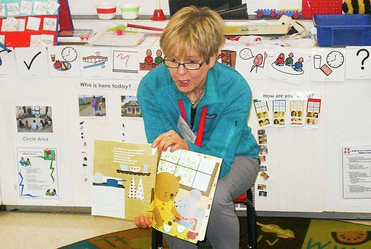 Diane Stevens, a member of the Midland Kiwassee Kiwanis, reads to Head Start children at Longview Elementary Early Childhood Center recently from a book gifted to them. Kiwanis members have committed to read to Midland County classrooms each month to support a mission to close the achievement gap for children. (Submitted photo/Mavis McDaniel) 