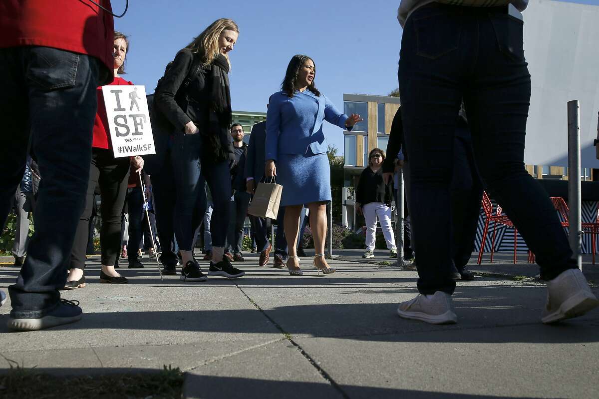 Mayor London Breed leads a contingent of pedestrians on Octavia Street in Hayes Valley to City Hall for a Walk to Work Day rally in San Francisco, Calif. on Wednesday, April 10, 2019.