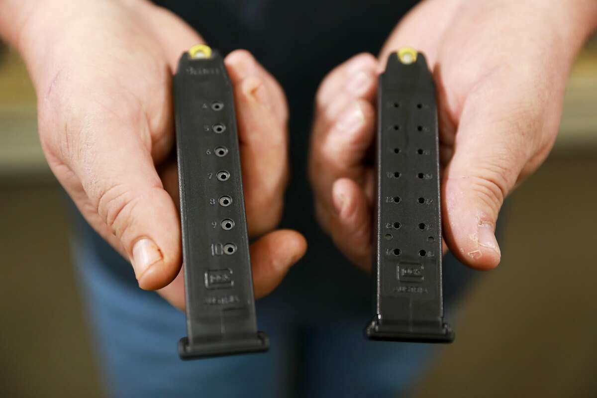 Gun store owner John Parkin holds two magazines inside Coyote Point Armory in Burlingame, Calif., on Wednesday, April 10, 2019. The magazine on the left has 10 rounds and the magazine to the right has 17 rounds. Last week, a federal judge ruled that California's law banning high capacity magazines (they hold more than 10 rounds) is unconstitutional. For a week, state residents could buy the ammo legally for the first time in California since 2000. But, the judge halted ruling now as it gets appealed.