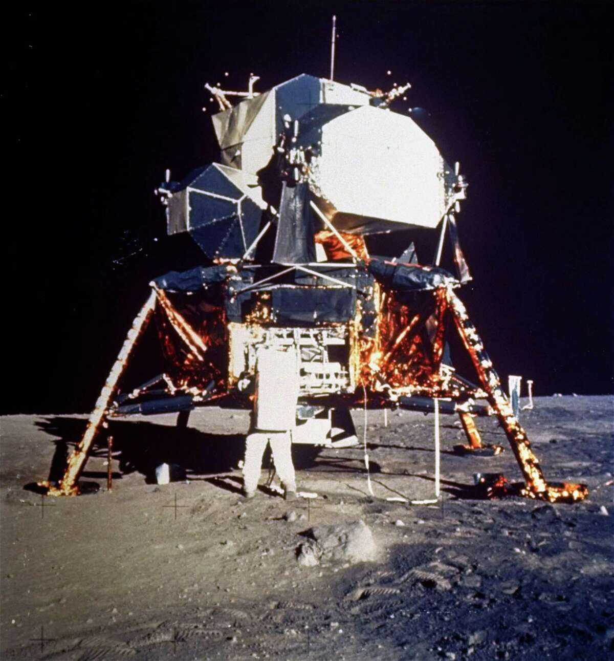 In this historic photo, Astronaut Buzz Aldrin prepares to deploy the Early Apollo Scientific Experiments Package (EASEP) during the Apollo II lunar surface extravehicular activity on July 20, 1969. Astronaut Neil A. Armstrong took the photograph with a 70mm lunar surface camera.