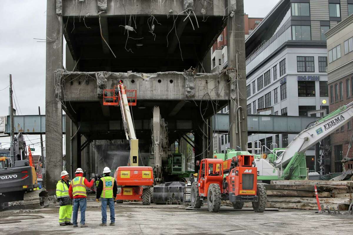 Work continues on dismantling the double decker portion of the Alaskan Way Viaduct near Columbia and Marion Streets, Wednesday, April 10, 2019. (Genna Martin, Seattlepi.com)