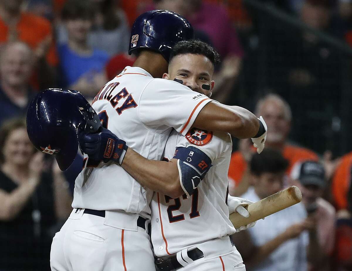 Michael Brantley, left, gives Jose Altuve a hug deserving of someone who has just homered for the second time Wednesday.