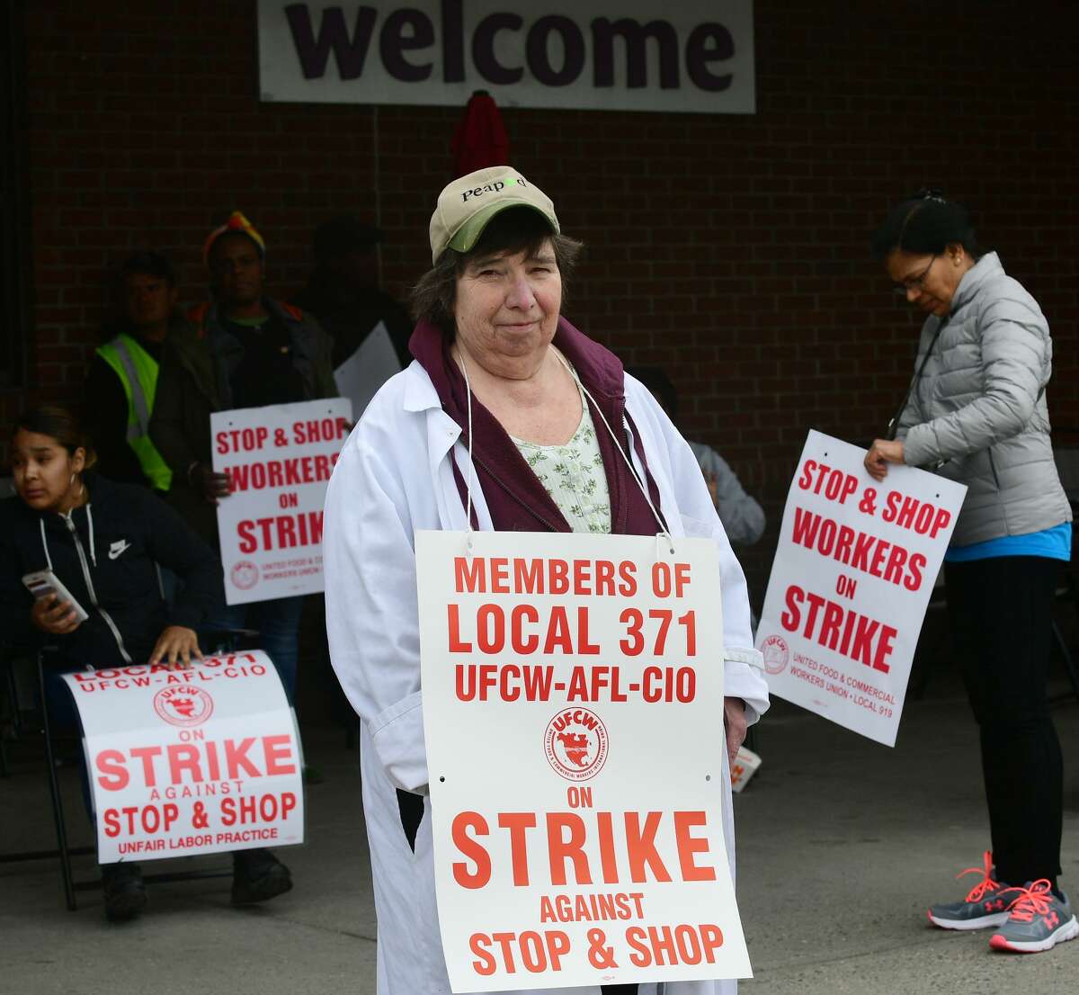 Workers with the UFCW-AFL-CIO Local 371 including Jean Federici strike Thursday, April 11, 2019, at the Stop & Shop on Main Avenue in Norwalk, Conn.