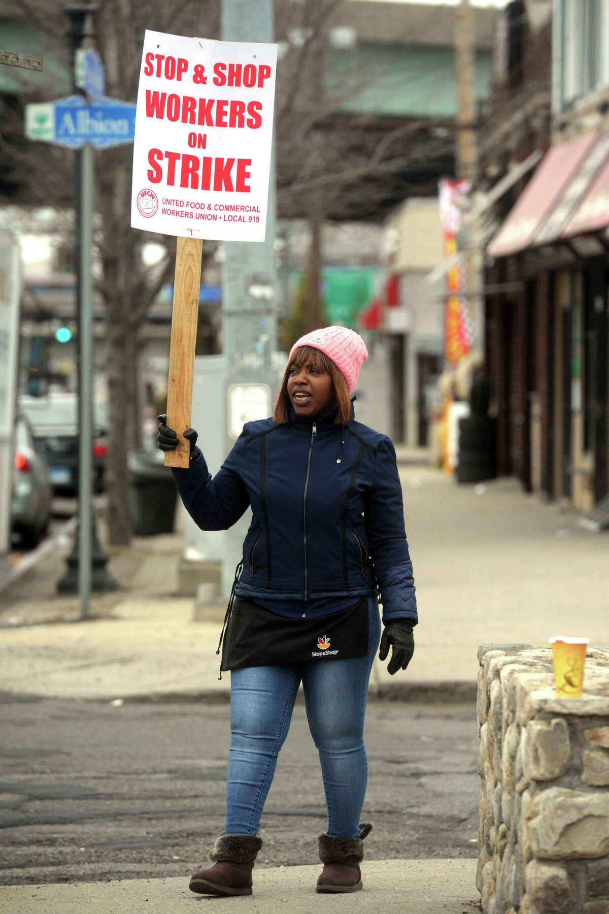 Reasheba McGhie, a pricing clerk at the Stop & Shop on Fairfield Ave., in Bridgeport, Conn. pickets in front of the store after she and her fellow union workers walked out on strike April 11, 2019. Stop & Shop employees across Connecticut and New England walked out on strike Thursday after failing to resolve a contract impasse.