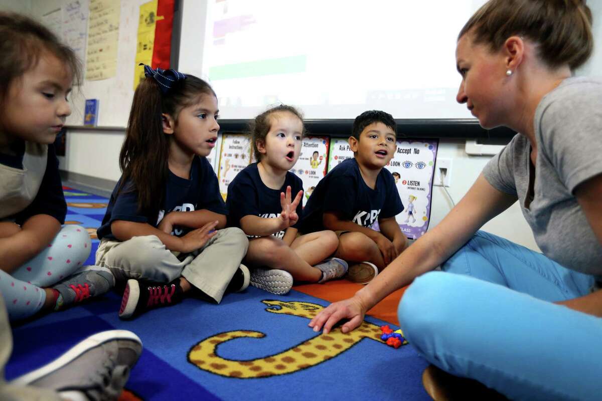 In this 2016 file photo, KIPP Explore Academy teacher Margaret Leiby helps students learn addition and subtraction in her Houston classroom. The region’s largest charter school operators, including KIPP Texas Public Schools, all aim to access the new Teacher Incentive Allotment later this year, which would give them additional funding for each high-rated teachers.