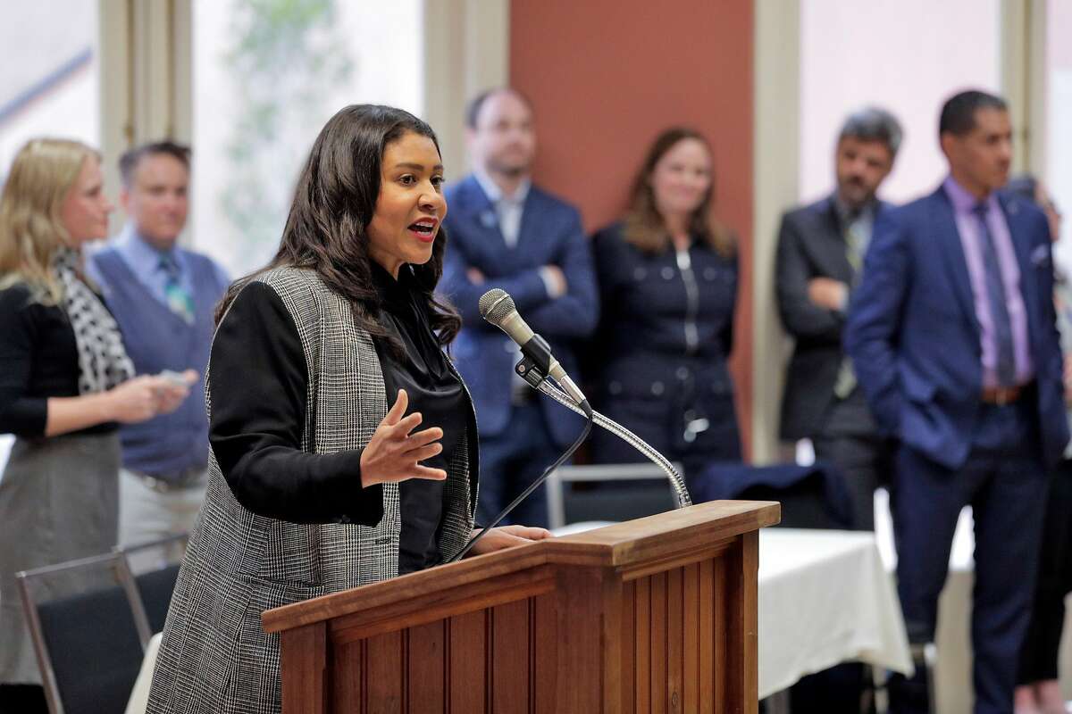 San Francisco Mayor London Breed tries to stop audience members from shouting as she addresses the crowd at the Delancey Street Foundation auditorium where city officials and neighborhood residents discussed a proposed navigation center for the homeless in San Francisco, Calif., on Wednesday, April 3, 2019.