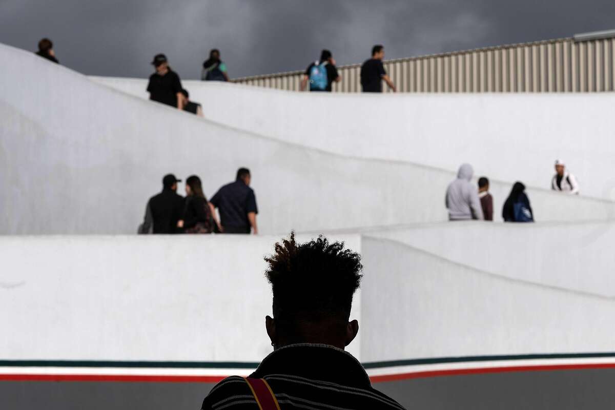 TOPSHOT - An asylum seeker waits outside El Chaparral port of entry as he waits for his turn to present to US border authorities to request asylum, in Tijuana, Baja California state, Mexico, on April 9, 2019. - A US federal judge on Monday blocked President Donald Trump's policy of returning asylum seekers to Mexico to wait out the processing of their cases, saying the Department of Homeland Security had overstepped its authority. (Photo by Guillermo Arias / AFP)GUILLERMO ARIAS/AFP/Getty Images